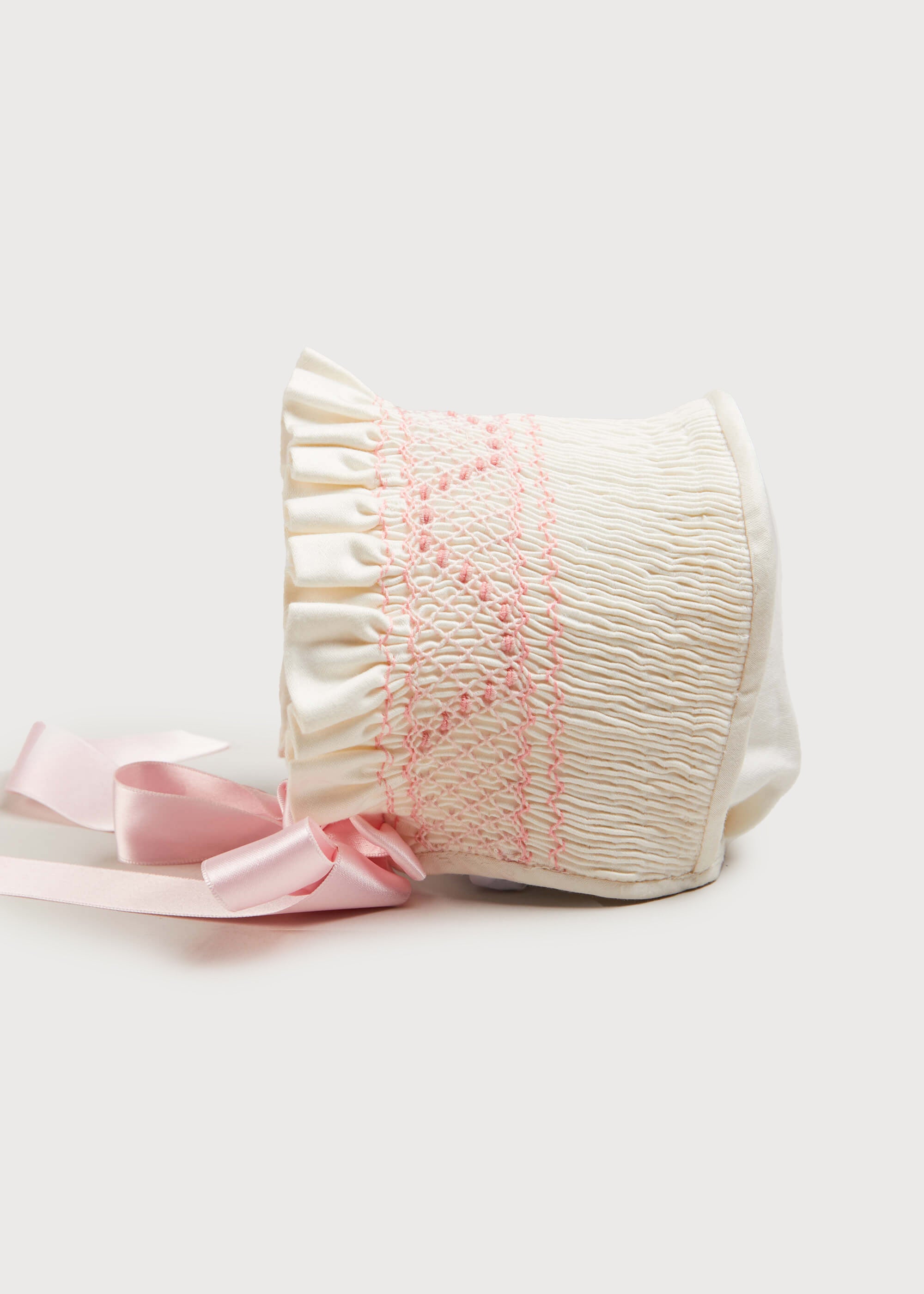 Off White and Pink Hand Smocked Baby Bonnet Knitted Accessories  from Pepa London