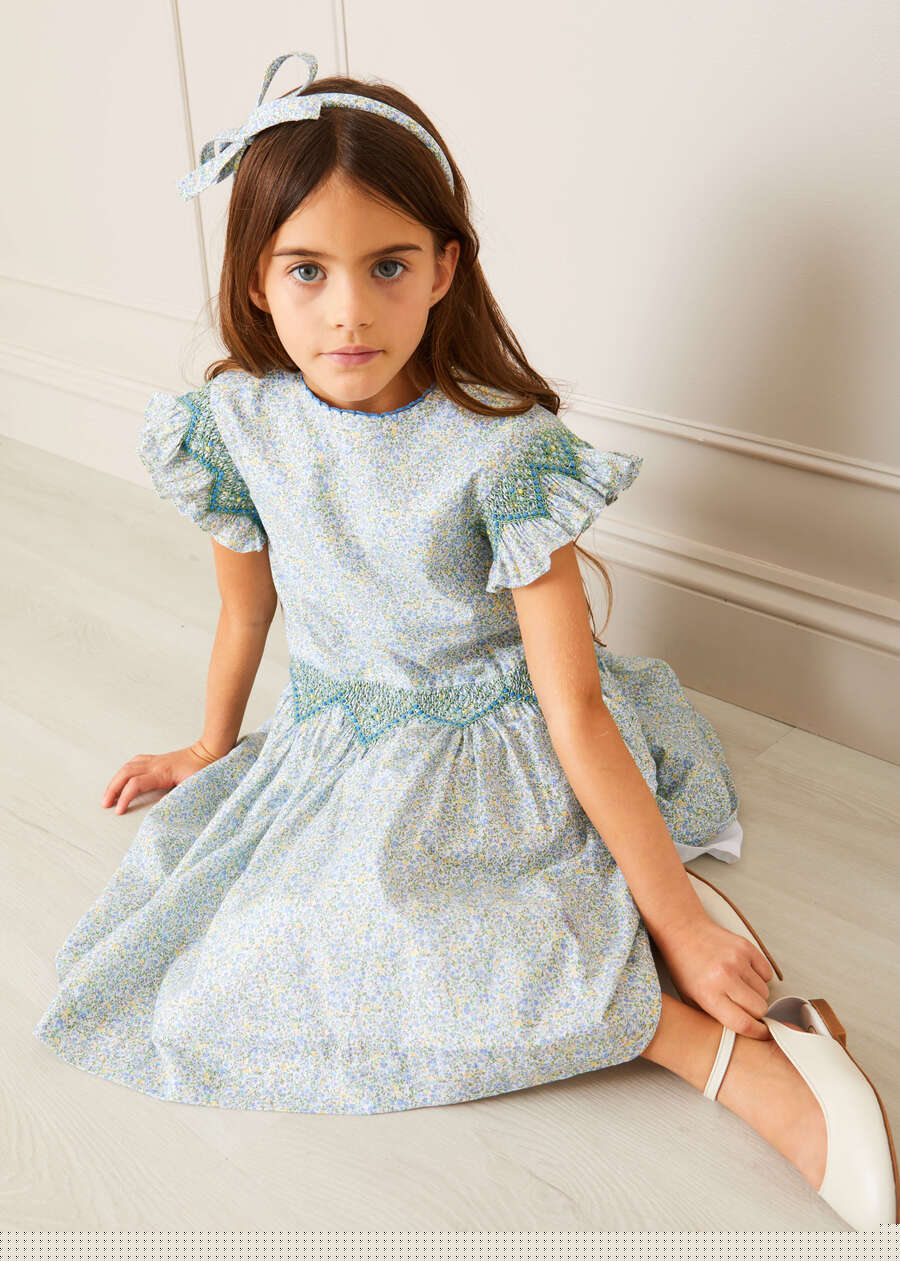 Matilda Floral Print Hand Smocked Sleeveless Dress in Blue (4-10yrs) Dresses  from Pepa London