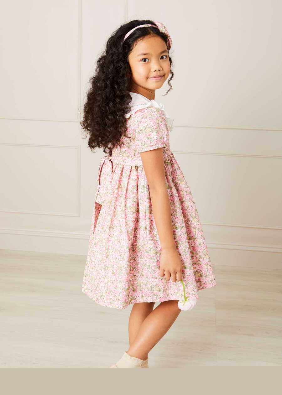 Eloise Floral Print Hand Smocked Short Sleeve Dress in Pink (12mths-10yrs) Dresses  from Pepa London